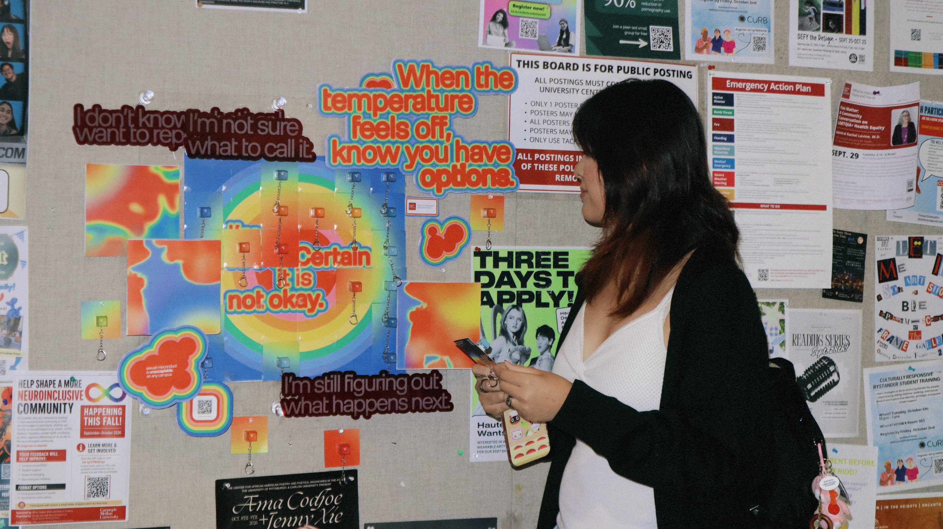 A student scanning the installation with her phone